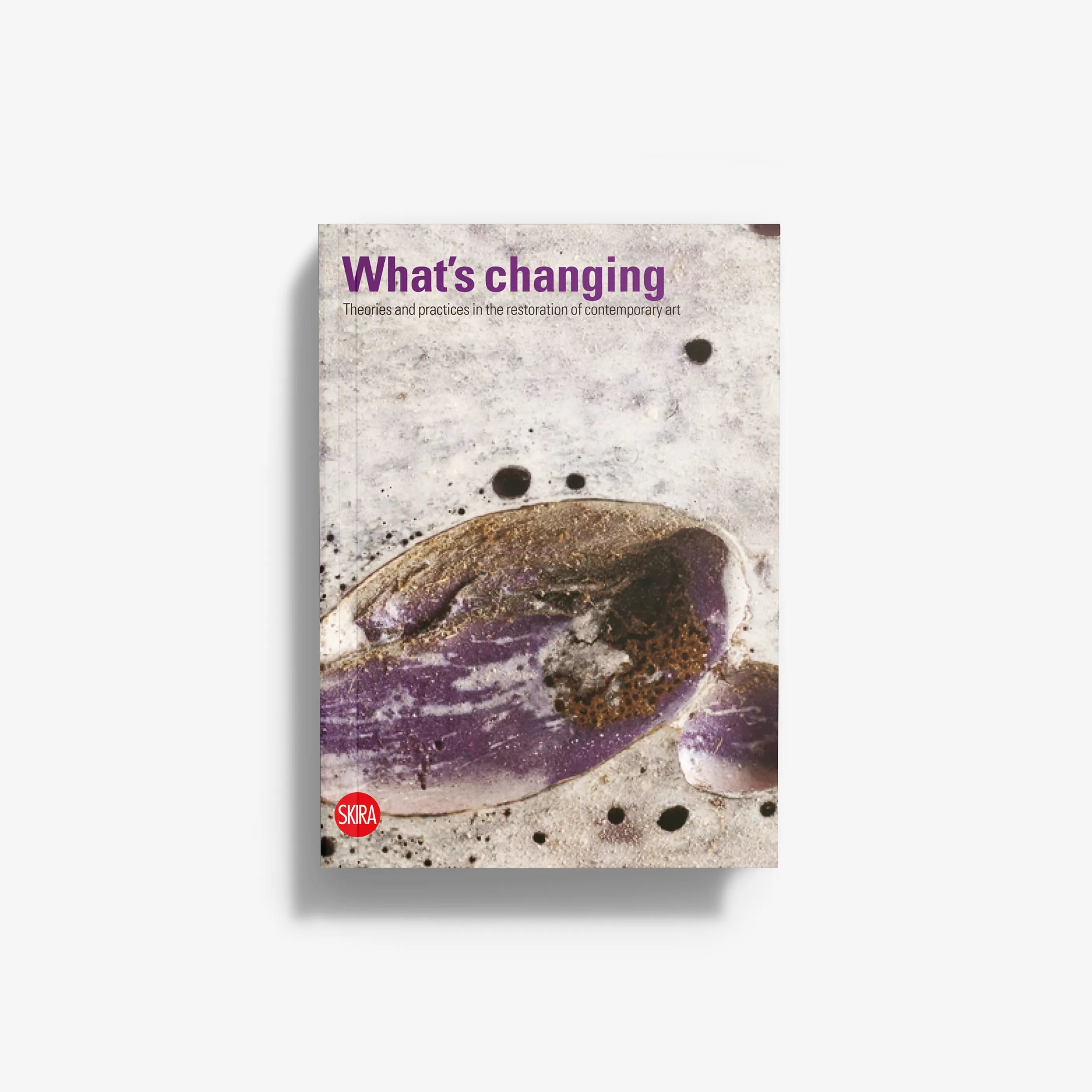 Book titled "What’s changing" with abstract purple and gray circular cover art