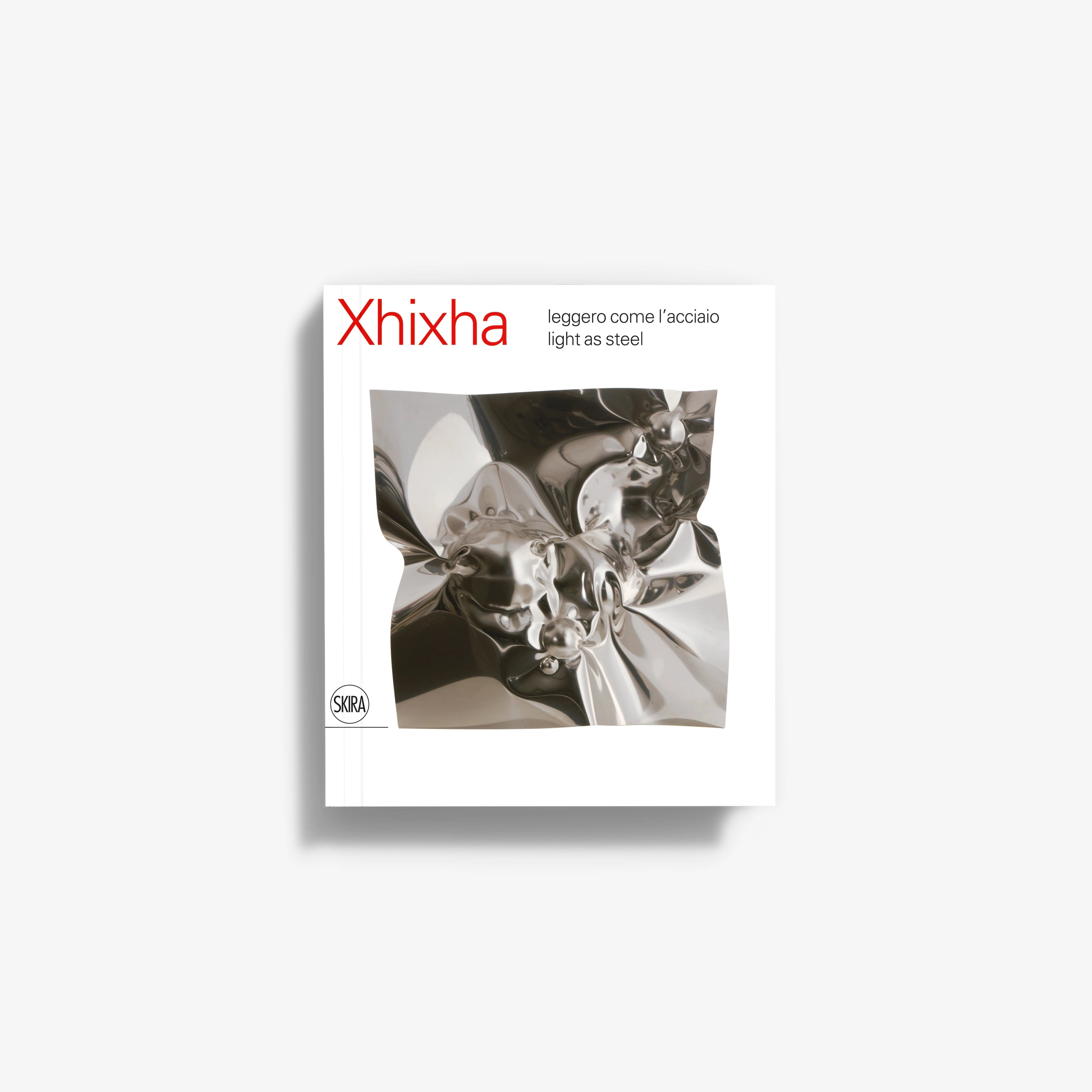 Xhixha silver foil product card with abstract metallic surface