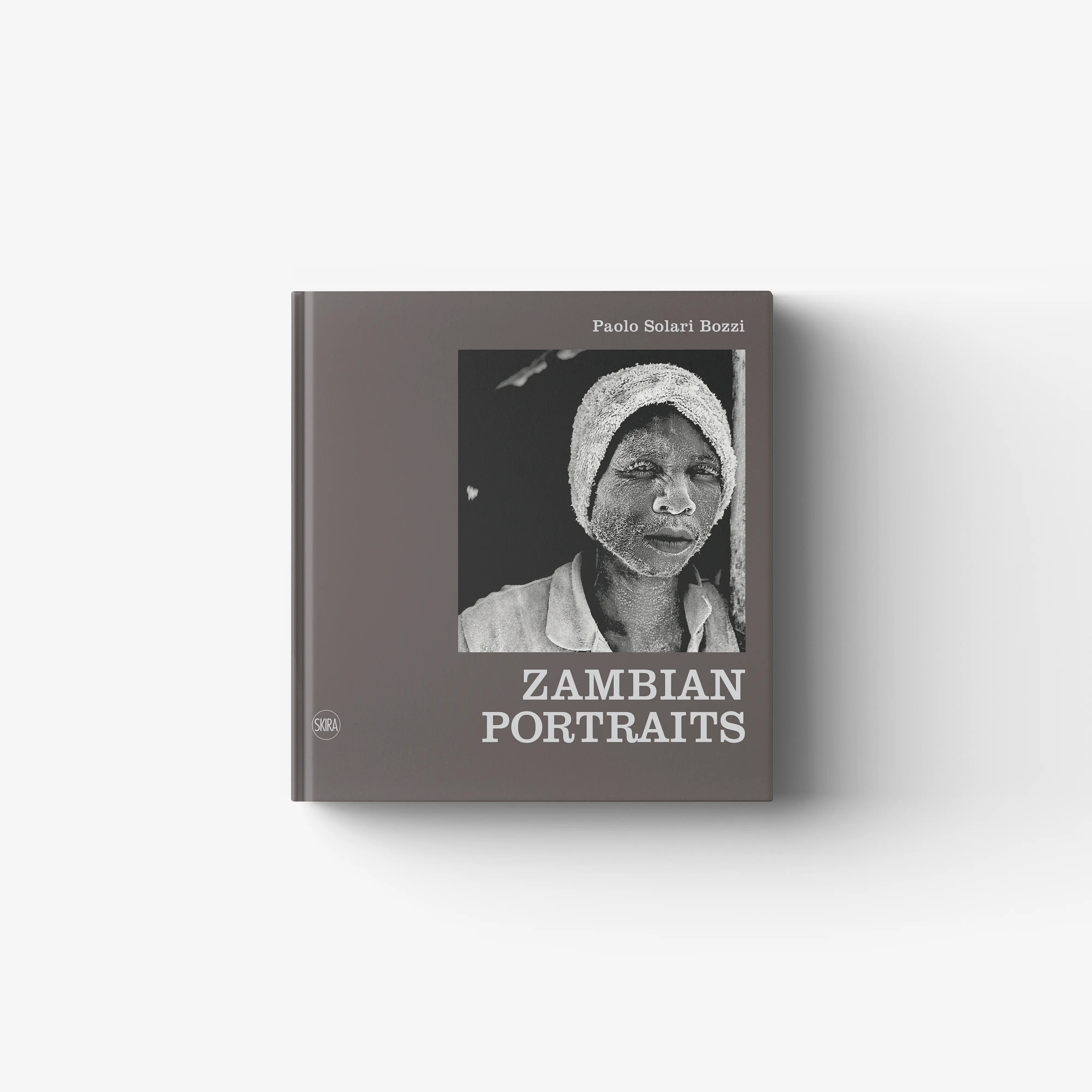Hardcover photo book with portrait cover, gray headwrap, titled Zambian Portraits